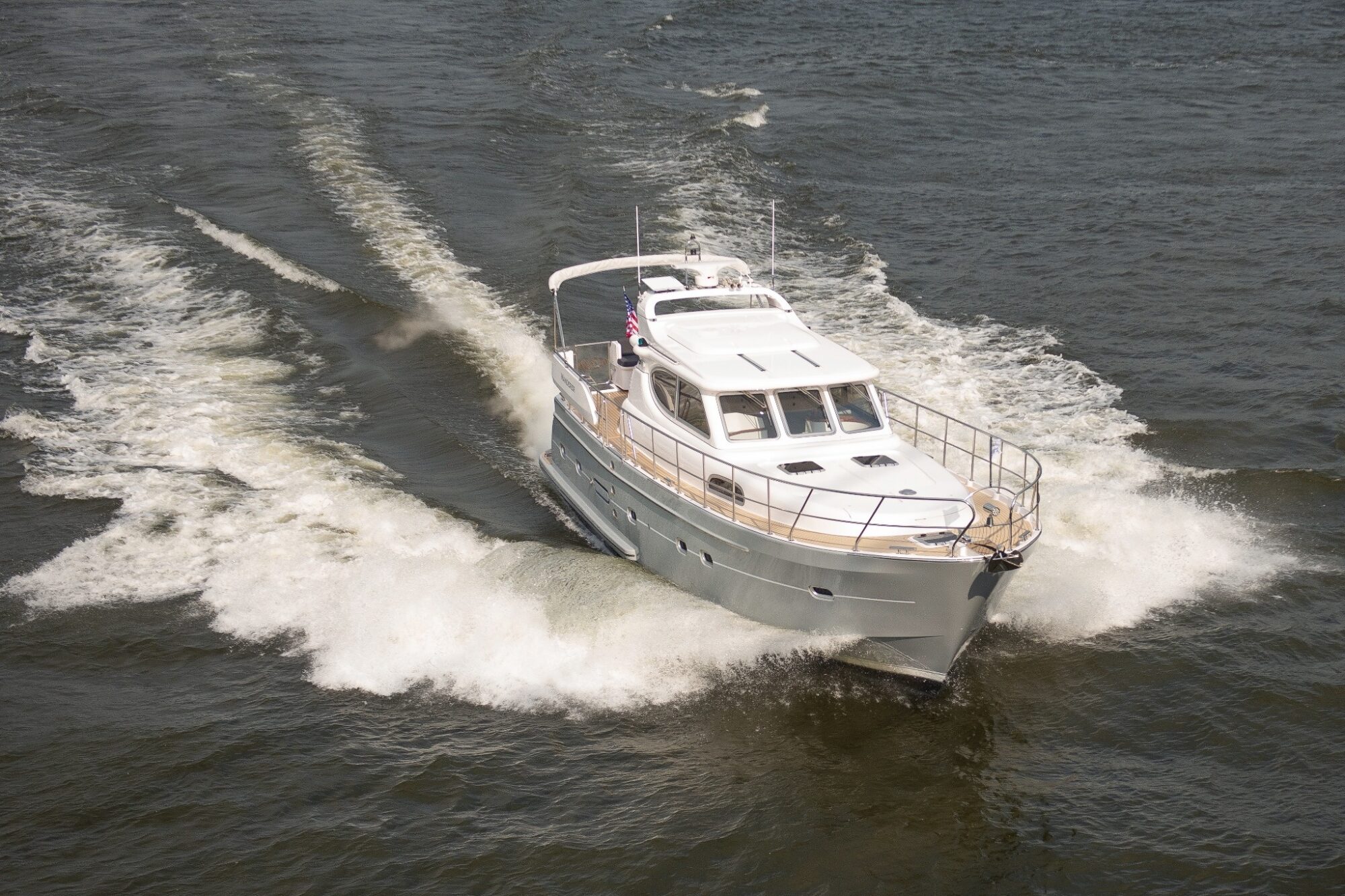 An Elling E4 motor yacht powers through open water, demonstrating impressive performance and smooth handling.